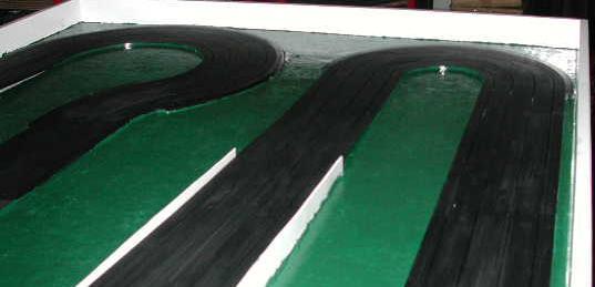 Track Edges Painted Green to Blend with the Table Top